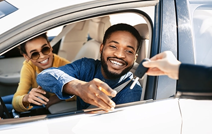 Couple looking at car